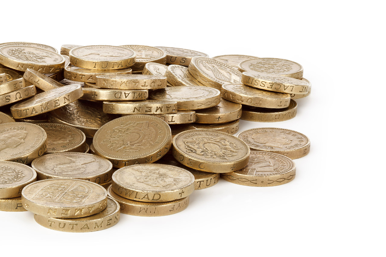 Pound coins on a desk